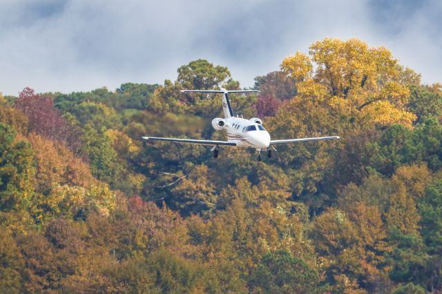 Cessna Citation Mustang (N323PG) - N323PG is a 2010 Cessna Citation 510 seen here on final approach to Atlanta's PDK executive airport on a beautiful fall afternoon. I shot this with a Canon 500mm lens. Camera settings were 1/6400 shutter, F4, ISO 500. Please check out my other photography. Positive votes and comments are always appreciated. Questions about this photo can be sent to Info@FlewShots.com