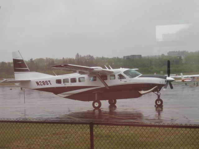 Cessna Caravan (N28ST) - Photo taken from inside the airport restaurant.