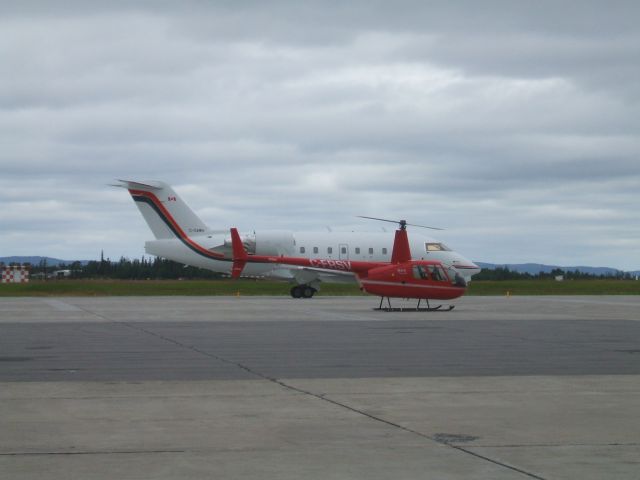 Robinson R-44 (C-FRSV) - Just landed in front of Woodward Aviation F.B.O. Goose Airport Lab.  Aug 15/8