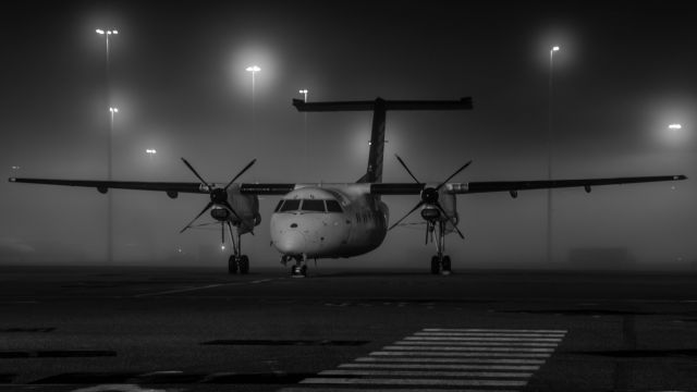 de Havilland Dash 8-300 (VH-XFQ) - Fog rolling through during the night - one couldn't resist a night photo. 