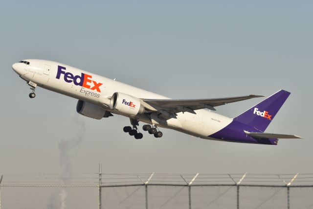 BOEING 777-200LR (N854FD) - Flt 096 departing 23-L bound for CDG yesterday morning, 01-26-22