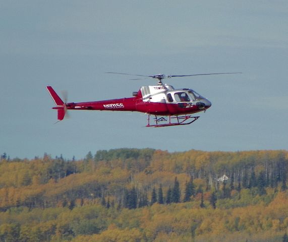 — — - AS350 returning from a job site.