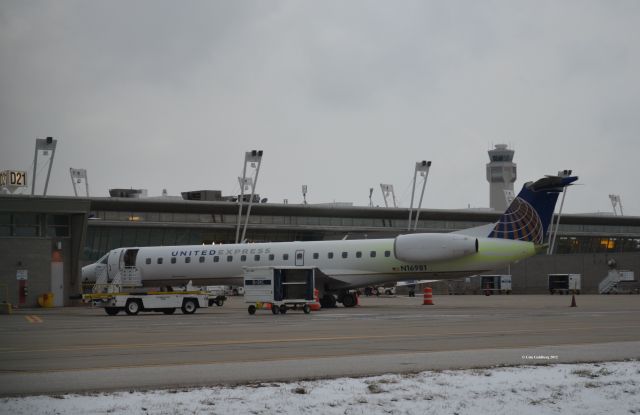 Embraer ERJ-145 (N16981) - N16981 seen at gate D21 with leftover Type IV de-icing fluid below the tail. Please look for more photos at Opshots.net