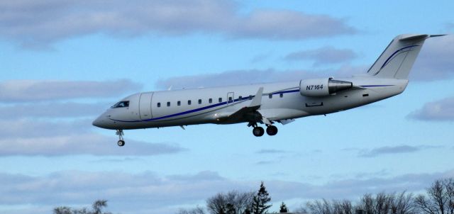 Canadair Regional Jet CRJ-200 (N7164) - On final is this 1997 Bombardier Canadair Regional Jet 100ER in the Autumn of 2021.