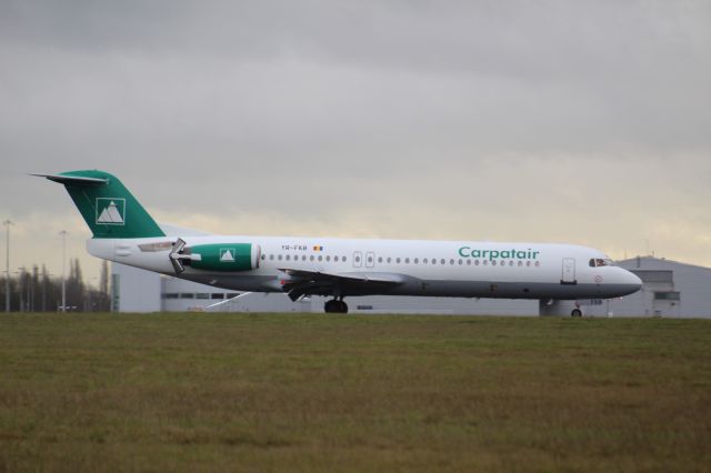 Fokker 100 (YR-FKB) - A Carpatair Fokker 100 slowing down after landing at London Stansted Airport, on runway 22.br /This Aircraft was carrying the Nice football team from Nice, France to play against Tottenham in a friendly game.br /br /Location: London Stansted Airport.br /Date: 21.12.22 (dd/mm/yy).