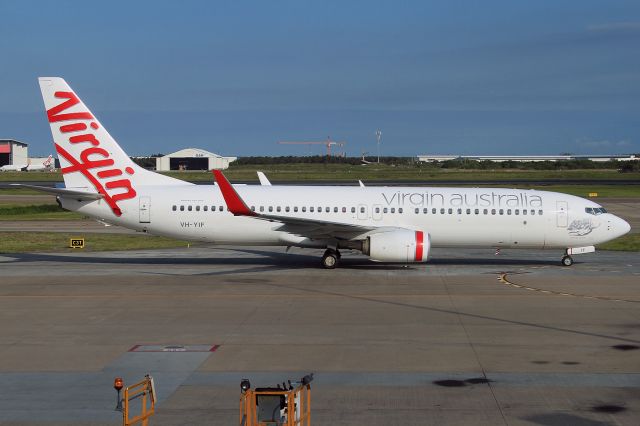 Boeing 737-800 (VH-YIF) - Taken thru the glass of the departures lounge