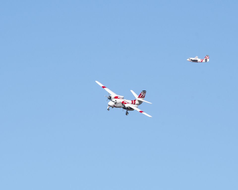 Beechcraft Baron (58) (N458DF) - CalFire Tanker 79 turns base to final at Paso Robles, Ca to take on another load of retardant while Tanker 74 exits the pattern with a fresh load for the Mineral Fire in western Fresno County