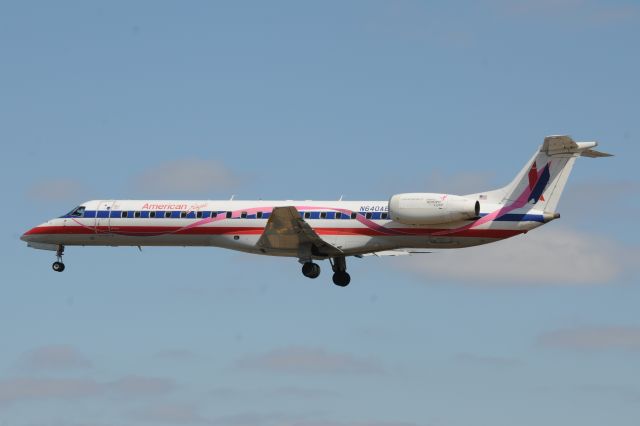 Embraer ERJ-145 (N640AE) - Susan Kohlman race for the cure pink ribboned aircraft. Landing 33-L earlier today.