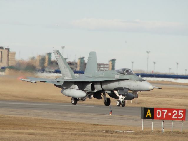 — — - Canadian Forces CF-18 taxiing in for a fuel stop.