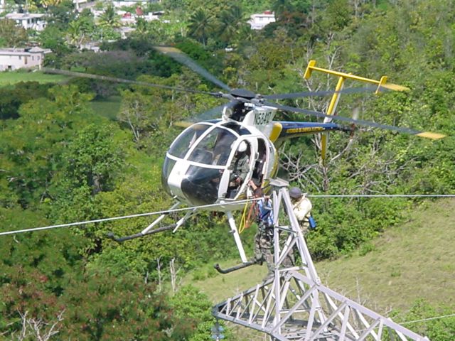 N5842Z — - Aerial lineman transfer operation during a 230KV Transmission Line repair by Puerto Rico Electric Power Authority.