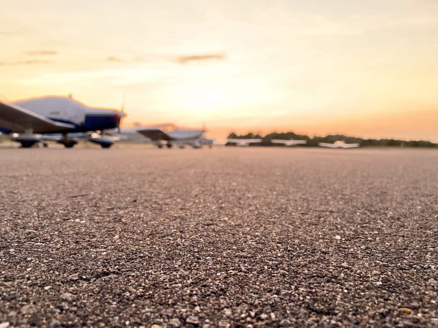 — — - Sunset on the tarmac