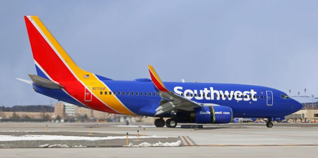 Boeing 737-700 (N7720F) - Thrust is still being reversed as Southwest's N7720F comes past my position after landing on 34R to complete a morning flight from downstate (McCarran International KLAS - KRNO Reno/Tahoe International).