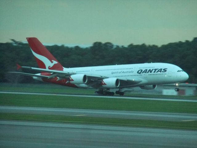 Airbus A380-800 (VH-OQG) - Qantas A380-800 VH-OQG landing on rwy 20C SIN. Seen in the evening of 30.11.2012 from out of T3.