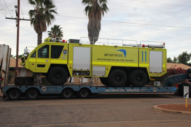 — — - Fire appliance on a transporter heading to northern Western Australia