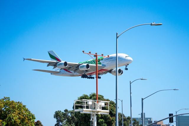 A6-EOL — - Big Beast! Captured this from the parking lot of In-N-Out Burger, next to LAX airport just after I landed there.  Did not hear it approaching.  The reaction of customers pointing at something, turned my attention to it almost too late to capture it.  She was absolutely beautiful and so quiet, compared to other jets. 