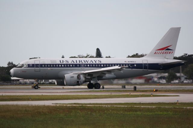 Airbus A319 (N745VJ) - US Air Flight 2015 (N745VJ) "Allegheny Airlines Heritage" arrives at Sarasota-Bradenton Interantional Airport following a flight from Charlotte-Douglas International Airport