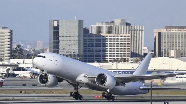 BOEING 777-200LR (N704GT) - Departing LAX on 25L