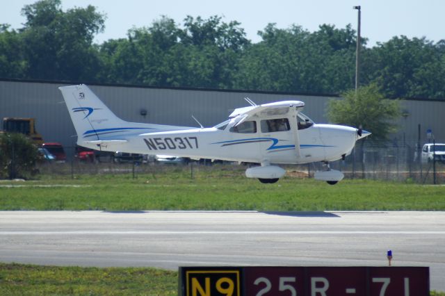 Cessna Skyhawk (N50317) - Not an uncommon sight here in Daytona, a Cessna settling down on 25R. Like my photos? Follow me on Twitter: @nsandin88