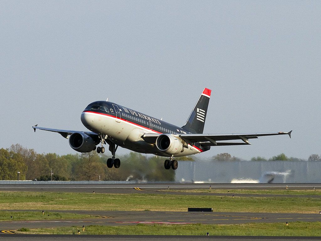 Airbus A319 (N770UW) - This "blue top" Airbus 319 makes an afternoon takeoff from runway 36R, Charlotte, North Carolina USA