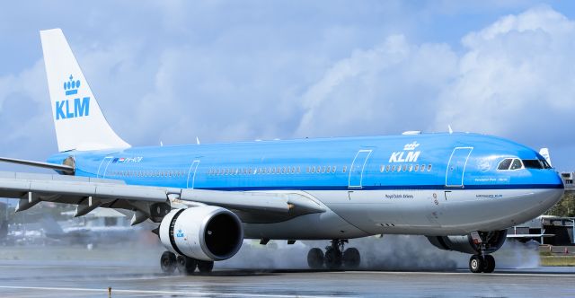 Airbus A330-200 (PH-AOB) - KLM Airbus A332 landing on a wet runaway at TNCM St Maarten.