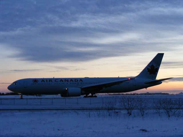 — — - no flash,natural light, 767 Air canada taxiing to take off point,runway#25