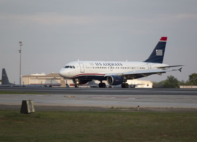 Airbus A319 (N755US) - This Airbus A319 is landing at Charlotte, North Carolina on runway 36R on April 21, 2013.