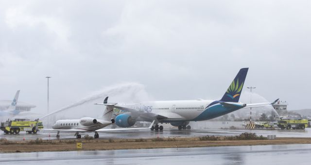 Airbus A350-900 (F-HNET) - Air Caraibes receiving her water canon salute for reentering her services between France and St Maarten with a A359.  