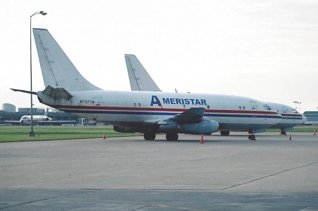 Boeing 737-200 (N737TW) - 05-16-2005. Sister Ship N767TW sitting behind her.