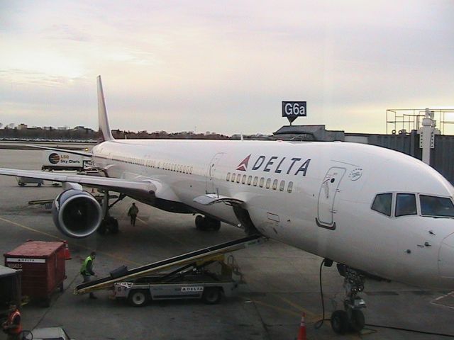 BOEING 757-300 (N584NW) - My plane I took back from Cancun on March 18, 2010.Parked at the customs gate G6a