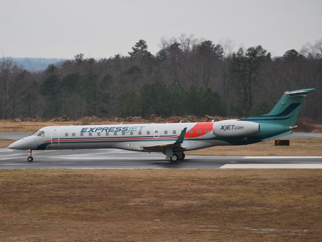 Embraer ERJ-135 (N11164) - Taking off in light rain on runway 20 at Concord Regional Airport - 2/18/09