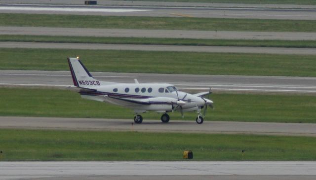 Beechcraft King Air 90 (N503CB) - Taken from the green parking garage. 