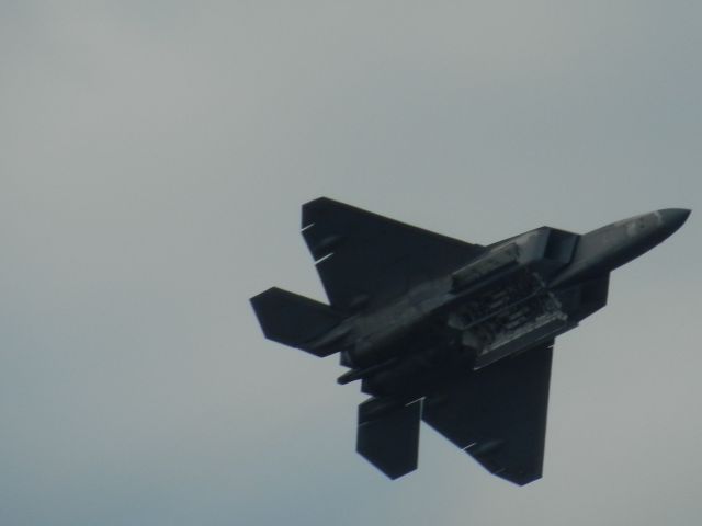 Lockheed F-22 Raptor — - An F-22 Raptor Flies By With Its Weapon Doors Open