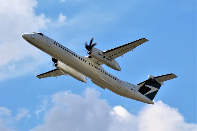 de Havilland Dash 8-400 (C-FENY) - A WestJet Encore departing CYUL.