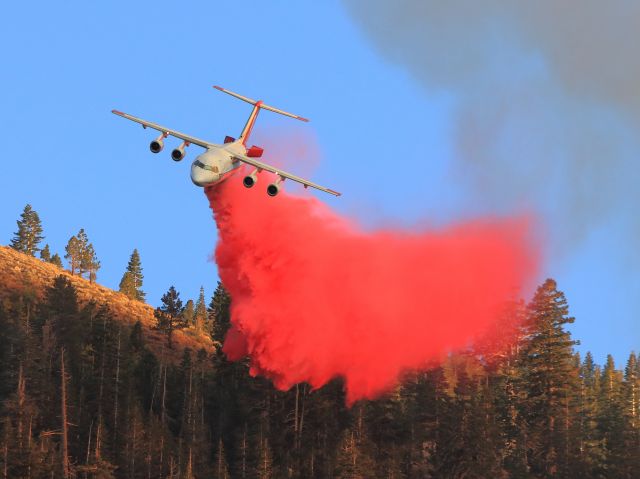 British Aerospace BAe-146-200 (N473NA) - Neptune Aviation Services BAe 146-200 Tanker 01, with speed brakes deployed on a down hill run... follows lead plane to make a critical forward rate of spread retardant drop on the threatening June Fire, June Lake CA., late afternoon 9-16-14.br /br /Neptune Aviation Services is located in Missoula, Montana. NAS fleet includes 7 modern BAe 146-200 aircraft(converted British Aerospace BAe 146-200, passenger carrier regional airliner), including Tankers 41, 40, 12, 10, 03, 02, 01 and are equipped with the innovative REV 3 tank capable of delivering a payload of 3,050 gallons of fire retardant.