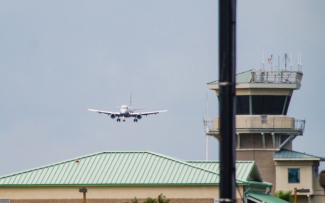 Embraer 175 (N124HQ) - Landing in front of a storm.  Along side Hilton Heads control tower.