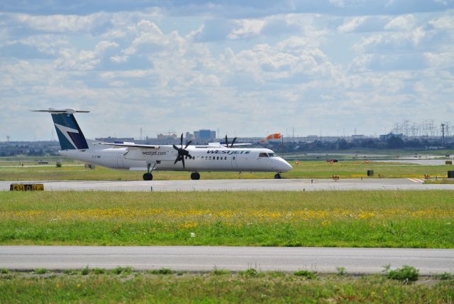 de Havilland Dash 8-400 (C-FIWE) - WestJet encore Dash 8 holding short 23 ready for departure