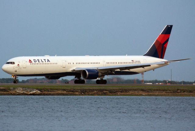 BOEING 767-400 (N842MH) - Delta B767-400 with Vince Dooley sticker departing BOS for LHR. 