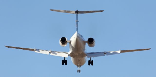 Fokker 100 (VH-XWR) - Approaching runway 01.