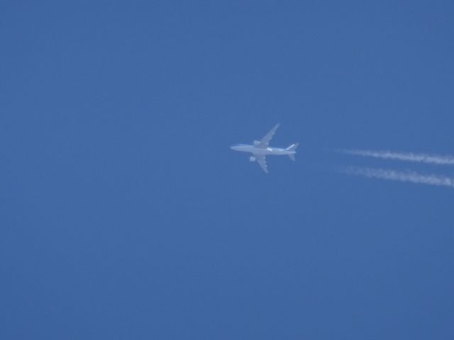 — — - KlM 777-200er over Fargo.