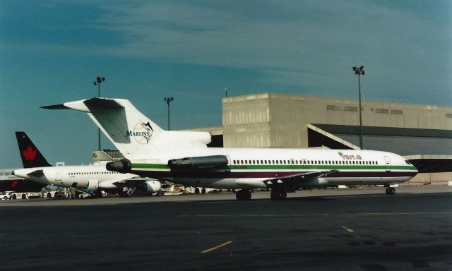 BOEING 727-200 (N808MA) - From April 27, 1997 - Miami Air B727-200 with Miami Marlins Logon tail arriving at Boston Logans Terminal E doing a charter.