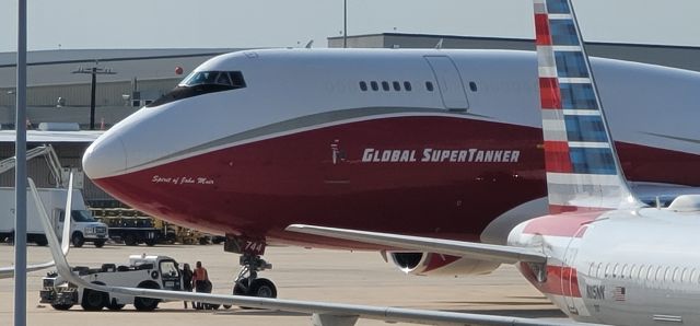 Boeing 747-400 (N744ST) - Global Super Tanker firefighting plane landed about an hour ago at San Antonio International Airport.  Image taken facing ST Engineering hangars from nearby parking garage.