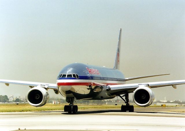 Boeing 777-200 (N774AN) - KSJC- American 777 taxis to 30 left at KSJC-I don't have my notes, but I'm sure this jet was the 1st AA 777 to serve SJC-NRT after being delivered new from Boeing-Everett to DFW- then a repositioning flight to SJC and RON for the Inaugural SJC-NRT flight the next day. Tis photo taken many years after- of course( But I was there for the Inaugural and have other pics I'll post later)