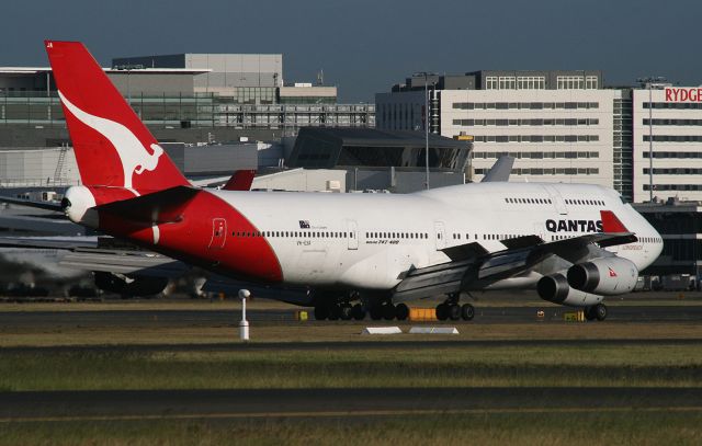 Boeing 747-400 (VH-OJA) - Photographed from the viewing mound at YSSY, 9 October 2014.