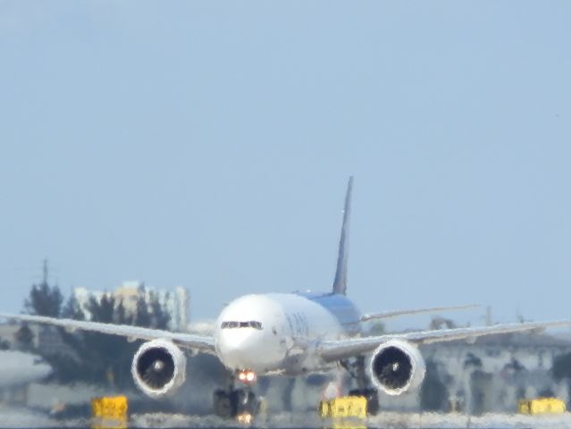BOEING 777-200LR (N776LA) - In the heat of the afternoon!