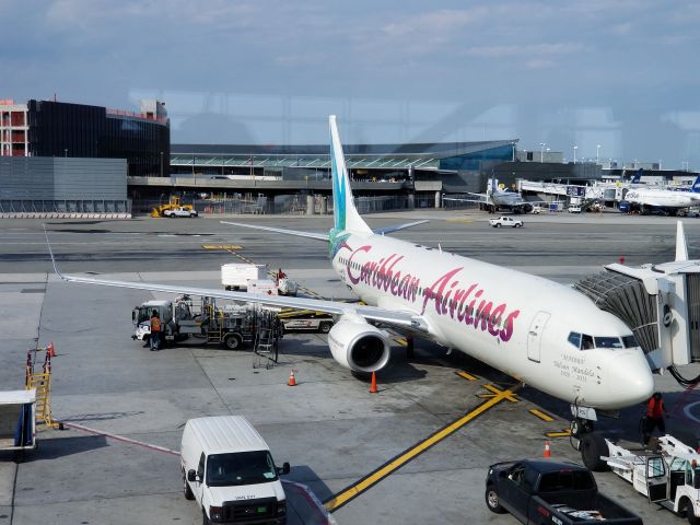 Boeing 737-700 (9Y-POS) - BW525 docked at gate A7 terminal 4, almost ready to start the boarding for its flight down to Piarco international POS.