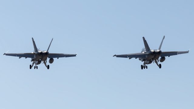 McDonnell Douglas FA-18 Hornet — - and this one . . . The Canon prime is a nice sharp lens, but not very good for formation landings such as this one, when you want to see the two aircraft side by side in profile at some point during the flypast. Next time, if there is one I will know better.