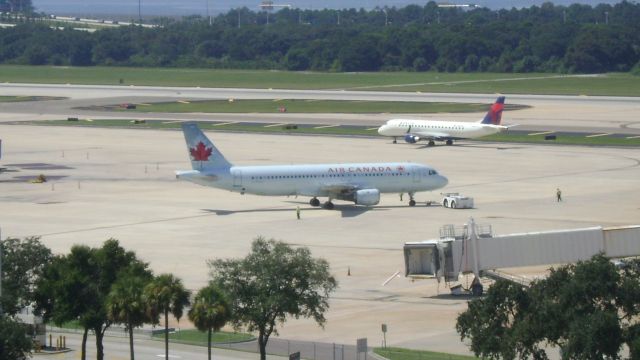 Airbus A320 (C-FLSU) - Being pushed back from gate