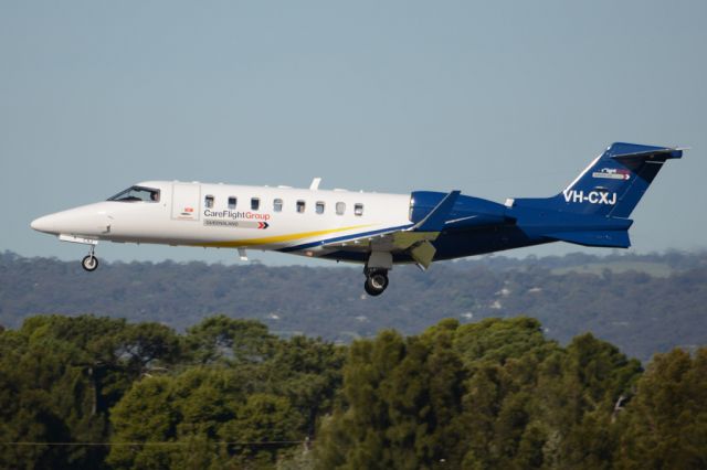 Learjet 45 (VH-CXJ) - On short finals for runway 05. Wednesday, 21st May 2014.