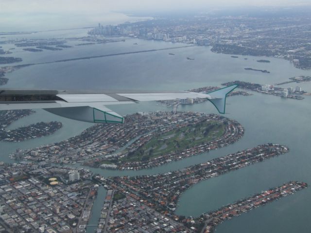 Airbus A320 (C-FTJR) - Getting ready to land at KMIA, the city just ahead and to our right, flying over Miami Beach....