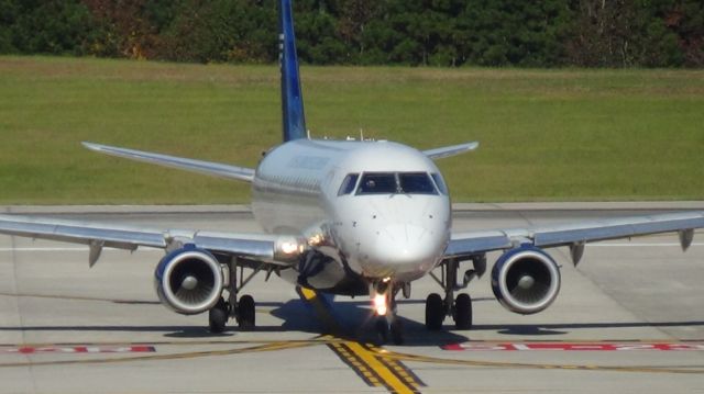 Embraer 175 (N121HQ) - Turning off runway 5L.